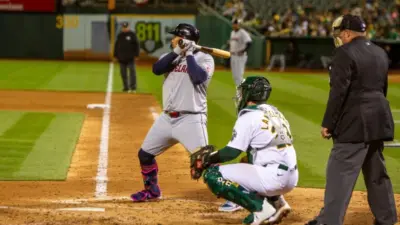 Oakland^ California - March 28^ 2024: Cleveland Guardians first baseman Josh Naylor bats against the Oakland Athletics on Opening Day at the Oakland Coliseum.