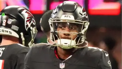 Atlanta Falcons quarterbacks Michael Penix Jr (9) before the game against the Carolina Panthers on January 5^ 2025 at Mercedes-Benz Stadium.