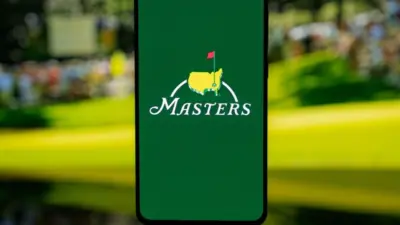 Smartphone displaying The Masters golf tournament logo on a green screen^ set against a blurred background^ representing professional sports media and tournament coverage. Kaunas^ Lithuania - 2026 March 12