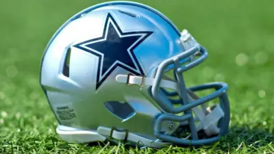 NFL Dallas Cowboys helmet on artificial grass playing turf ^ product shot