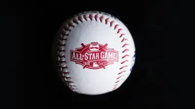 Close up baseball printed with logo for the 2015 Major League Baseball All-Star Game isolated on a dark black background. Cincinnati^ Ohio^ USA - July 21 2022
