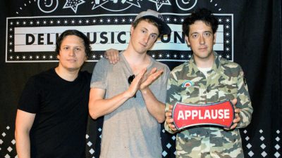 The Wombats in the Dell Music Lounge holding applause sign