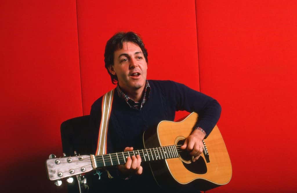 Paul McCartney playing guitar