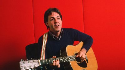 Paul McCartney playing guitar