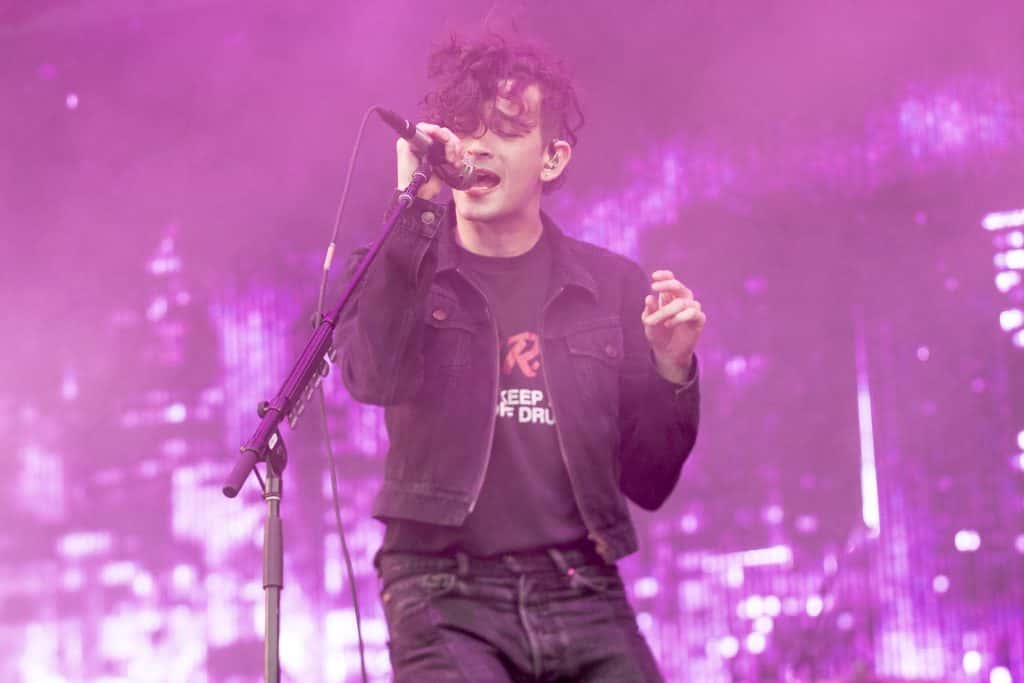 The 1975 singer Matty Healy performing