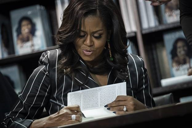 Michelle Obama Signing a Book