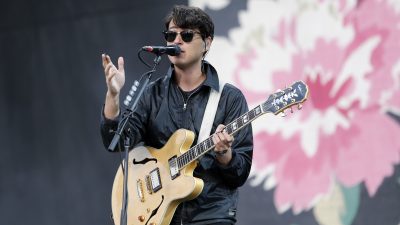 Vampire Weekend singing on stage