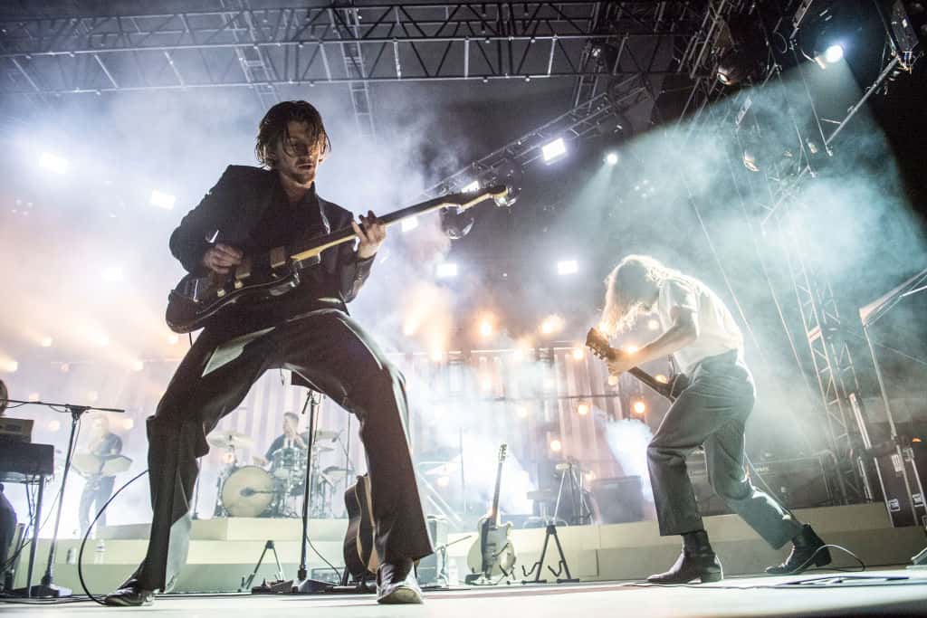 Arctic Monkeys performing on stage