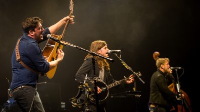 Mumford and Sons performing on stage