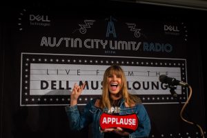 Grace Potter holding on-air sign