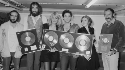 Fleetwood Mac At Wembley Anglo-American rock group Fleetwood Mac with awards for British sales of their albums 'Rumours' and Tusk', Wembley Arena, London, June 1980. The band are backstage at one of six shows between 20th - 27th June. Left to right: John McVie, Mick Fleetwood, Christine McVie, Lindsey Buckingham and Stevie Nicks. (Photo by Michael Putland/Getty Images)