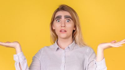 A lady with thick eyebrows.