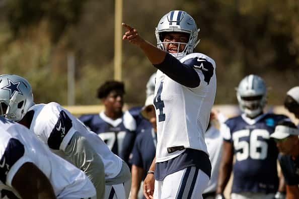 dak prescott on the field in cowboys jersey