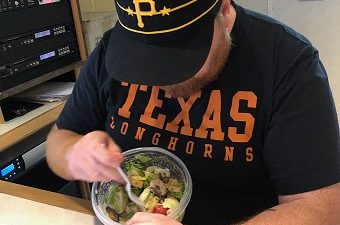 Jason eating a salad in studio.