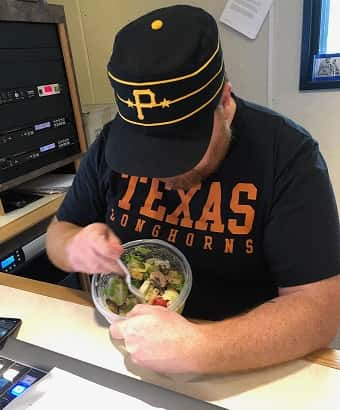 Jason eating a salad in studio.