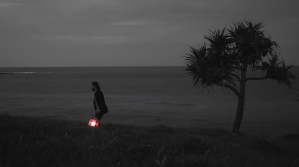 hayden thorpe on the beach at night