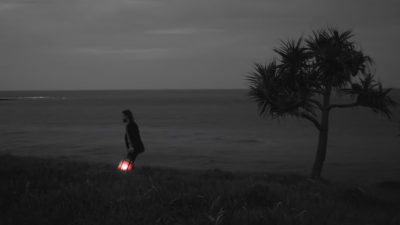 hayden thorpe on the beach at night