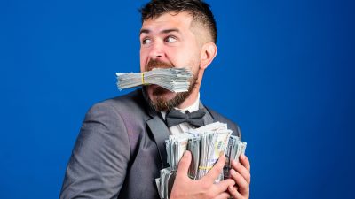 A guy hoarding a wad of cash.