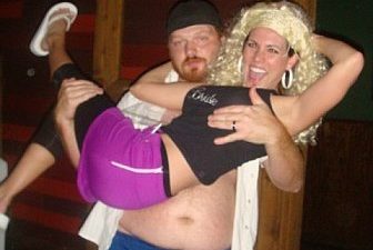 jason holding a bachelorette in his arms before he performs a strip tease for her
