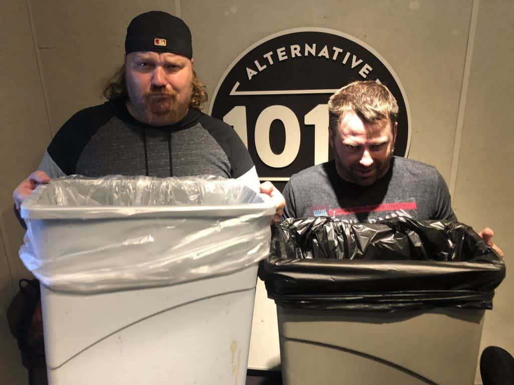 Jason and Doug the comedian in 101X studio holding up trash cans