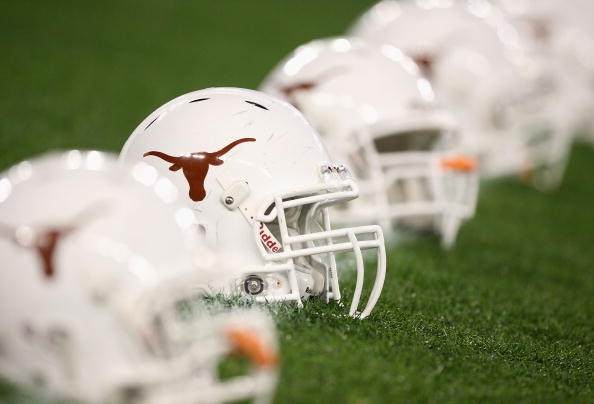 The Texas Longhorns helmets are arranged on the field