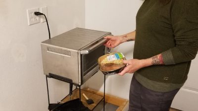 Deb cooking in the laundry room.
