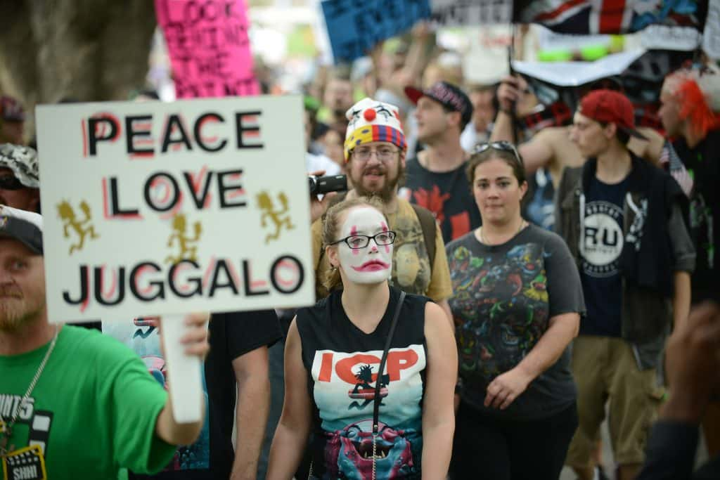 a fan of ICP with a peace love juggalo sign