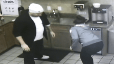 Deb gets sprayed trying to open up a dishwasher.