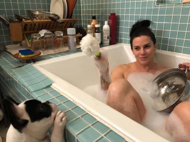 Deb doing dishes in the tub.