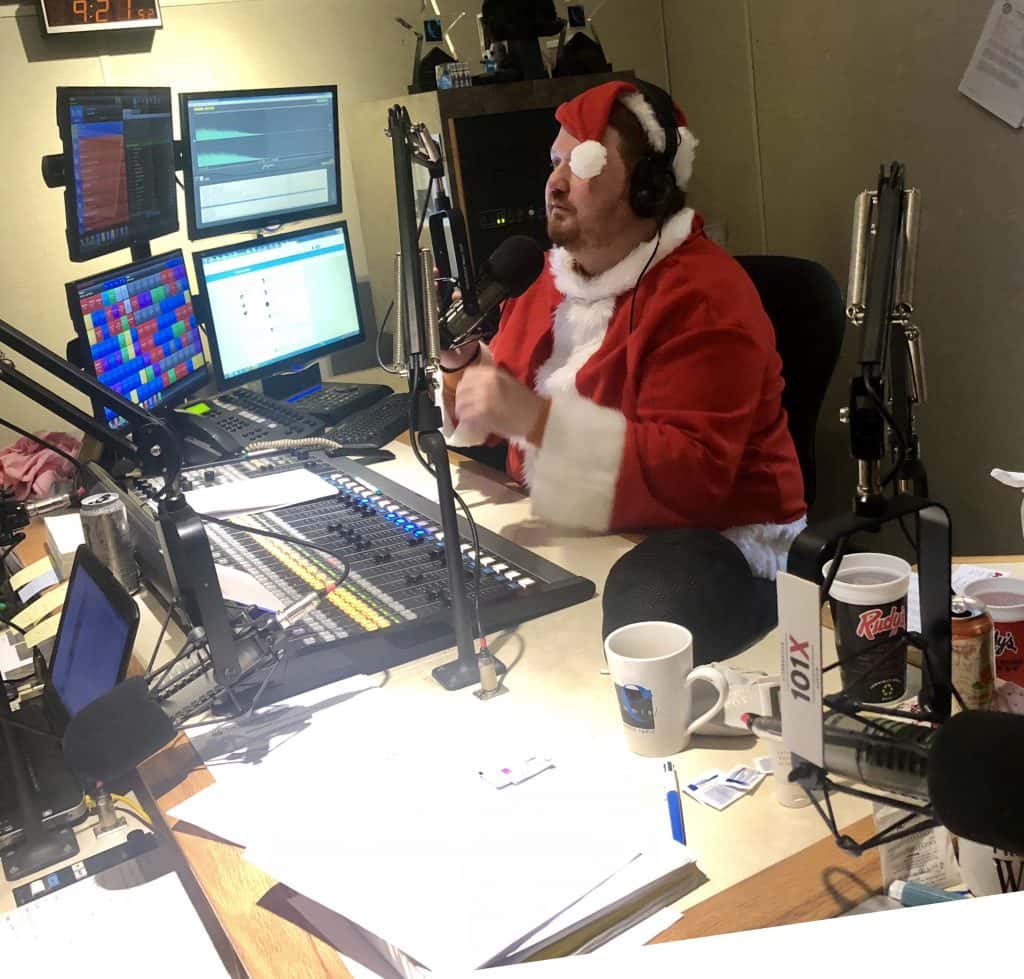 Jason in the studio with a Santa suit.