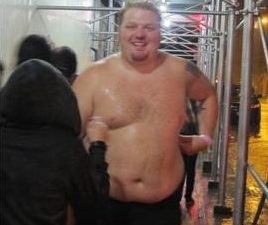Jason wet and shirtless after running through the streets of New York