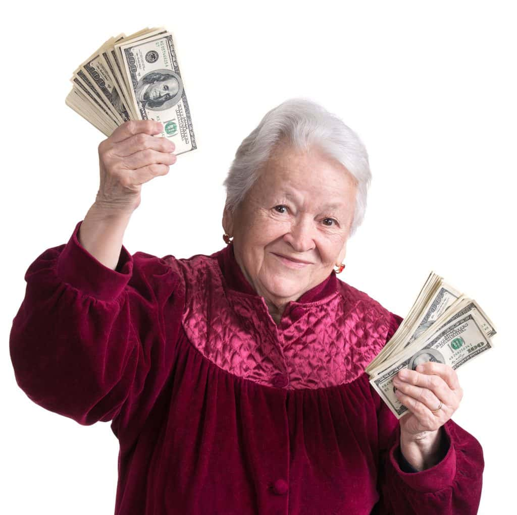 Older lady in pajamas with money in her hand