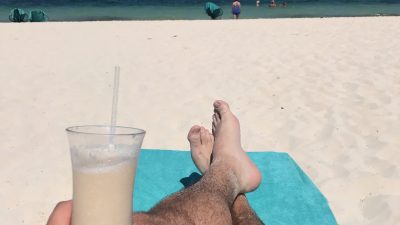 Nick Sitting on the Beach with a Pina Colada