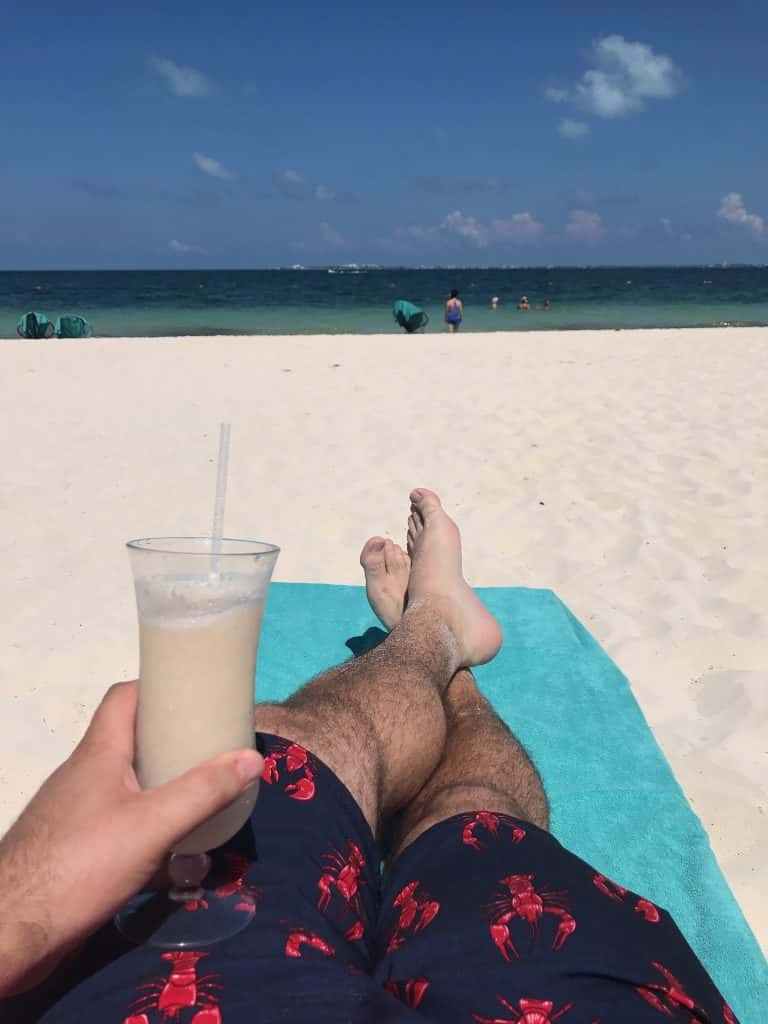 Nick Sitting on the Beach with a Pina Colada