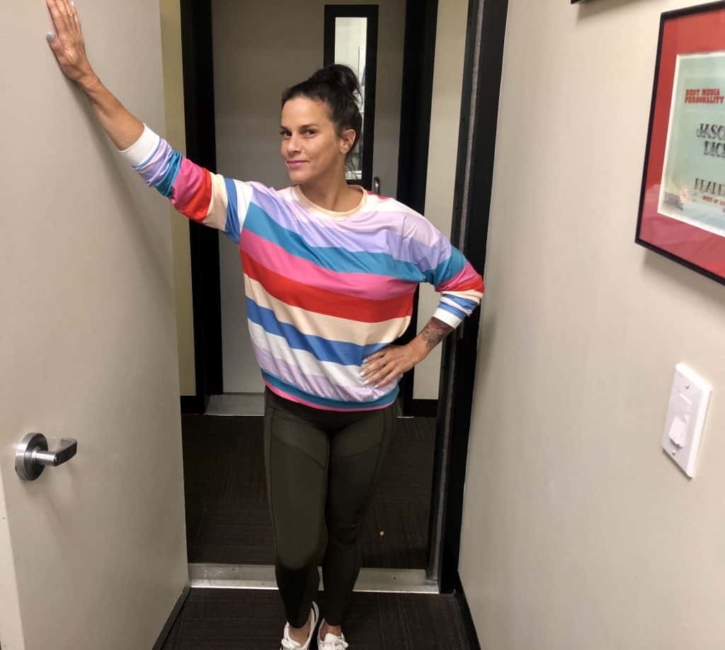 Deb in a colorful sweater she bought off of Instagram