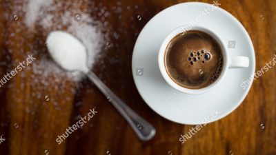 Coffee and a sugar packet from Men's Health magazine.