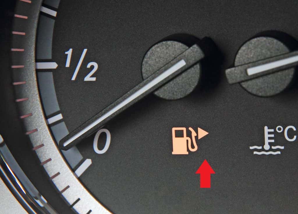 Shutter Stock Image of a Speedometer with a red arrow showing where the gas tank arrow is pointing