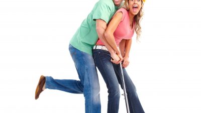A man and lady on a scooter.