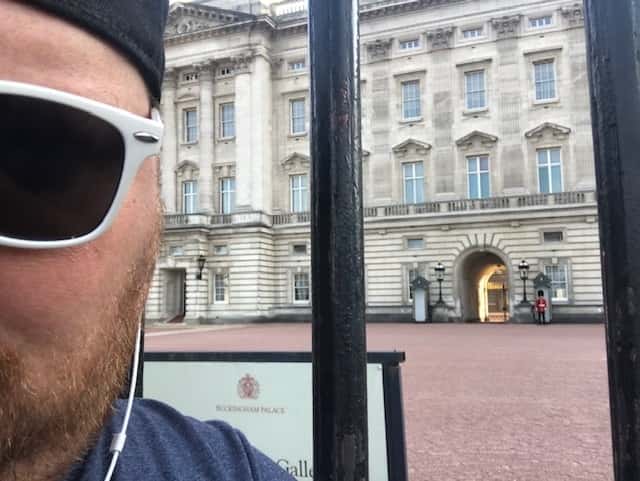 Jason with sun glasses in front of a building in Europe.