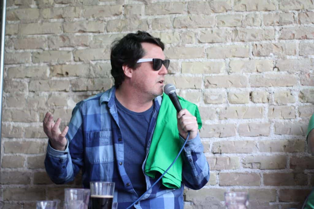 Doug Benson with a green shirt over his arms at the Jason and Deb St. Patty's day broadcast at King Fu.