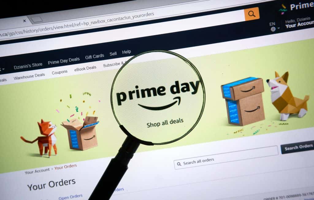 Amazon prime day page on official amazon site under magnifying glass.