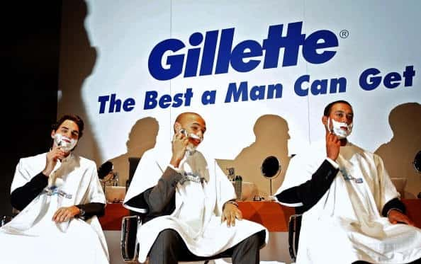 Gillette the best a man can get three sign with three men shaving.