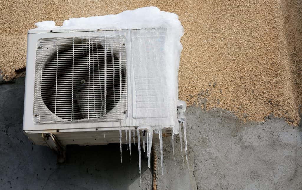 Shutter stock image of frozen air conditioning unit on a wall