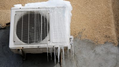 Shutter stock image of frozen air conditioning unit on a wall