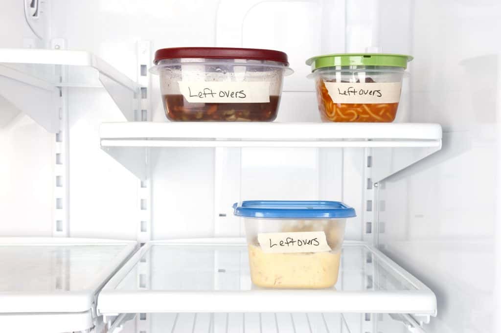 Labeled leftovers of food in a refrigerator.