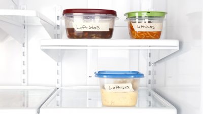 Labeled leftovers of food in a refrigerator.