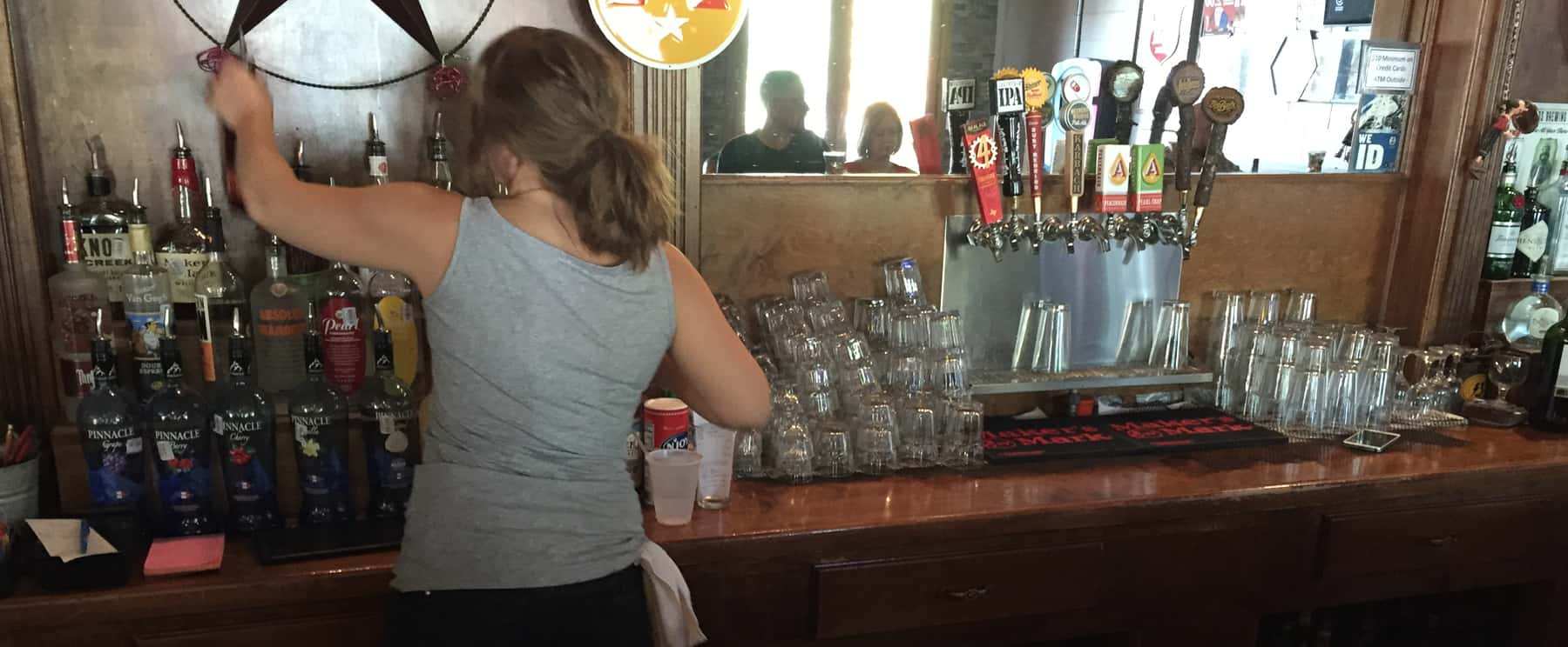 a woman pouring drink