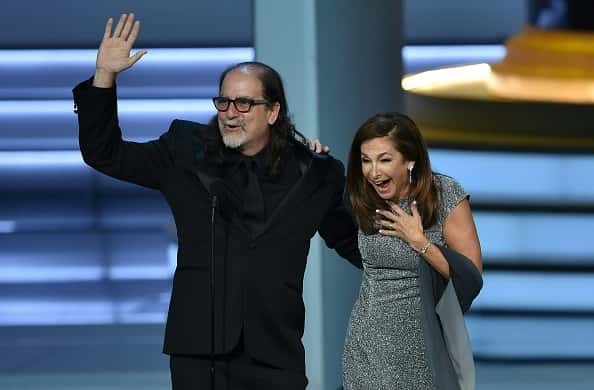 Glenn Weiss (L), winner of the Outstanding Directing for a Variety Special award for 'The Oscars,' waves to the audience after p