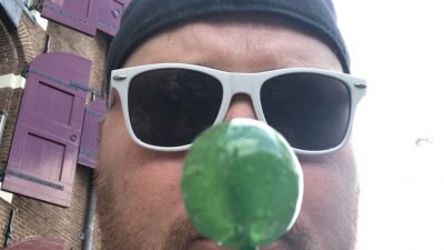 Jason eating green candy in Amsterdam.