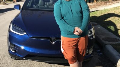 Jason in front of his new Tesla.